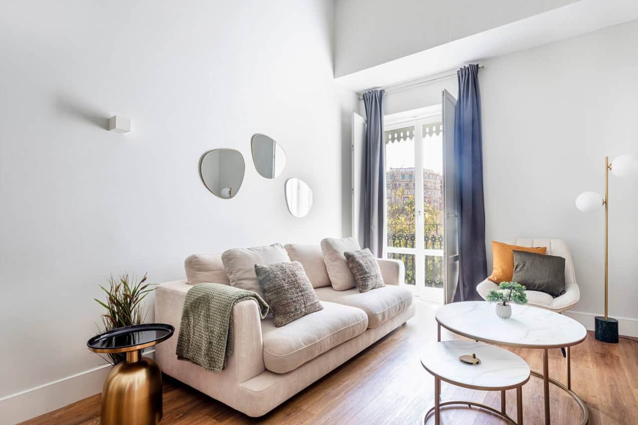 Bright and elegant space with city skyline views, perfect for relaxing or working.