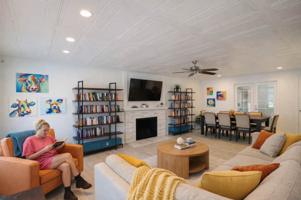 Open living and dining space with comfy seating, smart TV, books, and room to gather together. Open living and dining space with comfy seating, smart TV, books, and room to gather together.