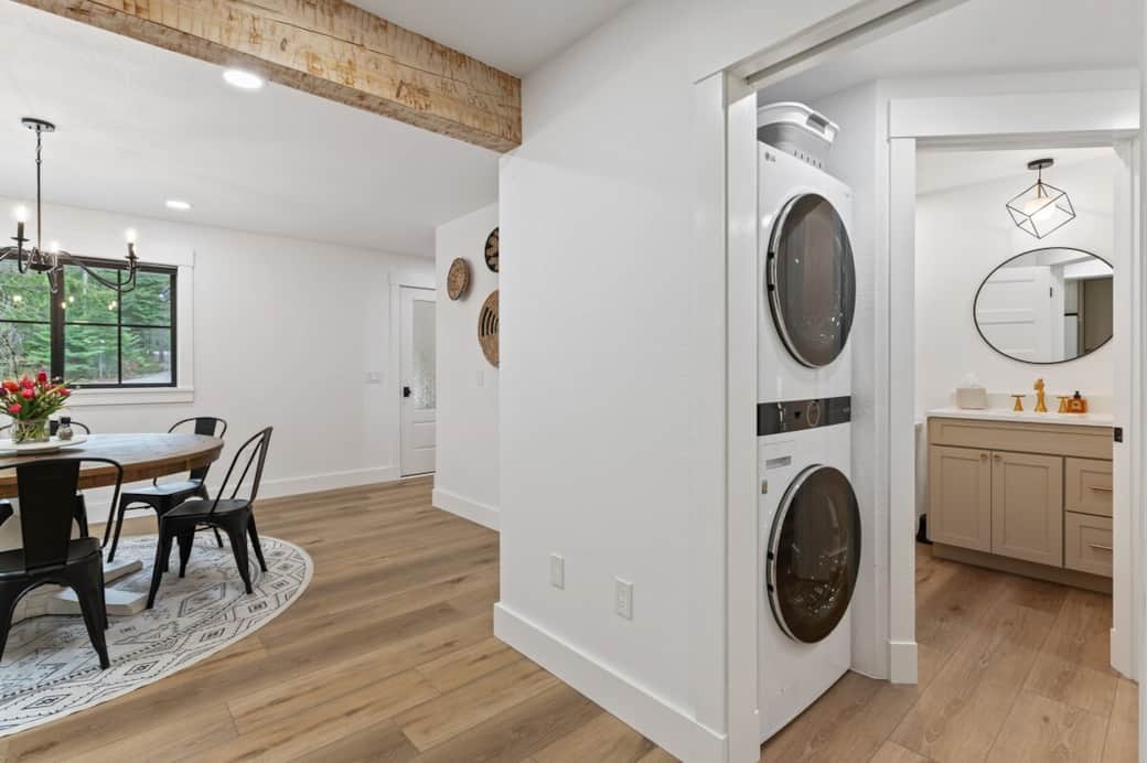 LG stackable washer & dryer with laundry sink in the same area. Detergent, fabric softener, & wool dryer balls give your load of laundry that extra special feel. Laundry basket on top to carry your items with. Please leave the washer ajar after use.