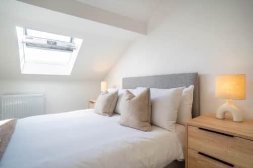 A bright bedroom with a skylight