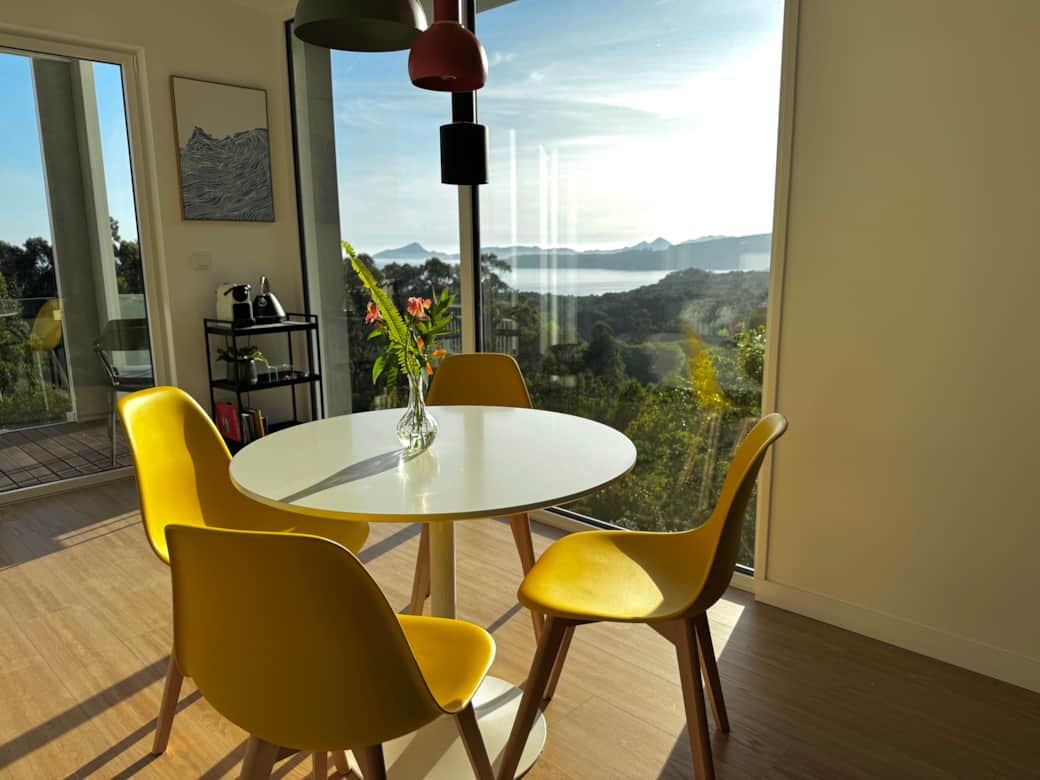 Open-plan living, dining, and kitchen space filled with natural light. Open-plan living, dining, and kitchen space filled with natural light.