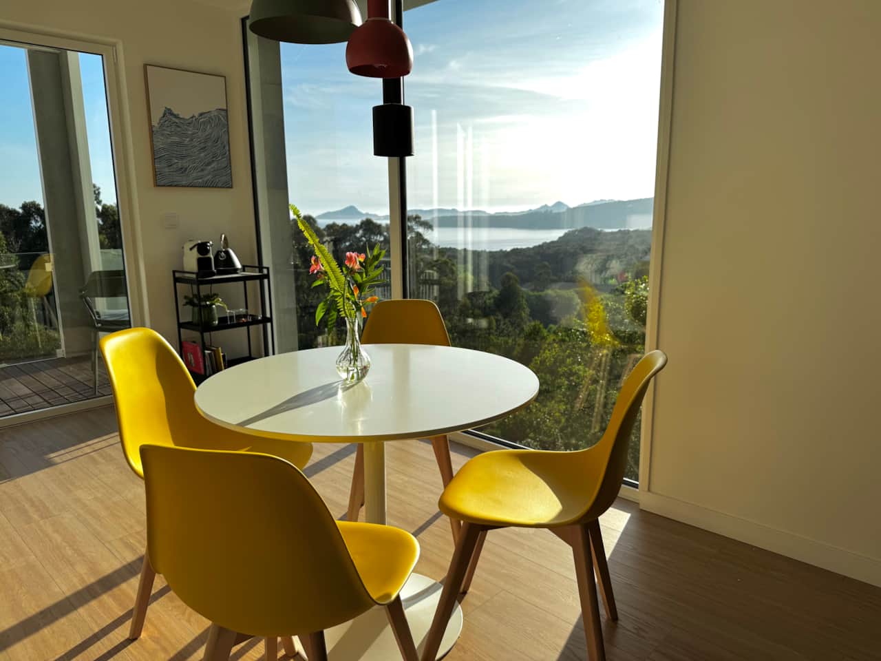 Open-plan living, dining, and kitchen space filled with natural light.