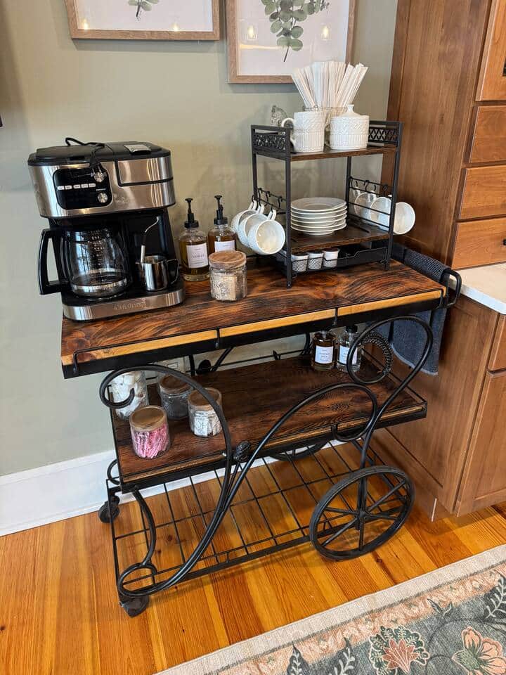 Start your day at the cozy coffee station—complete with syrups, cups, and sweet touches.