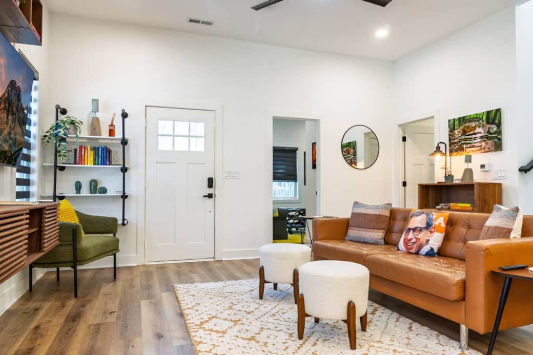 Open concept main floor with 65" smart television in the living space. Enjoy one-of-a-kind photography throughout the home, created by the host.