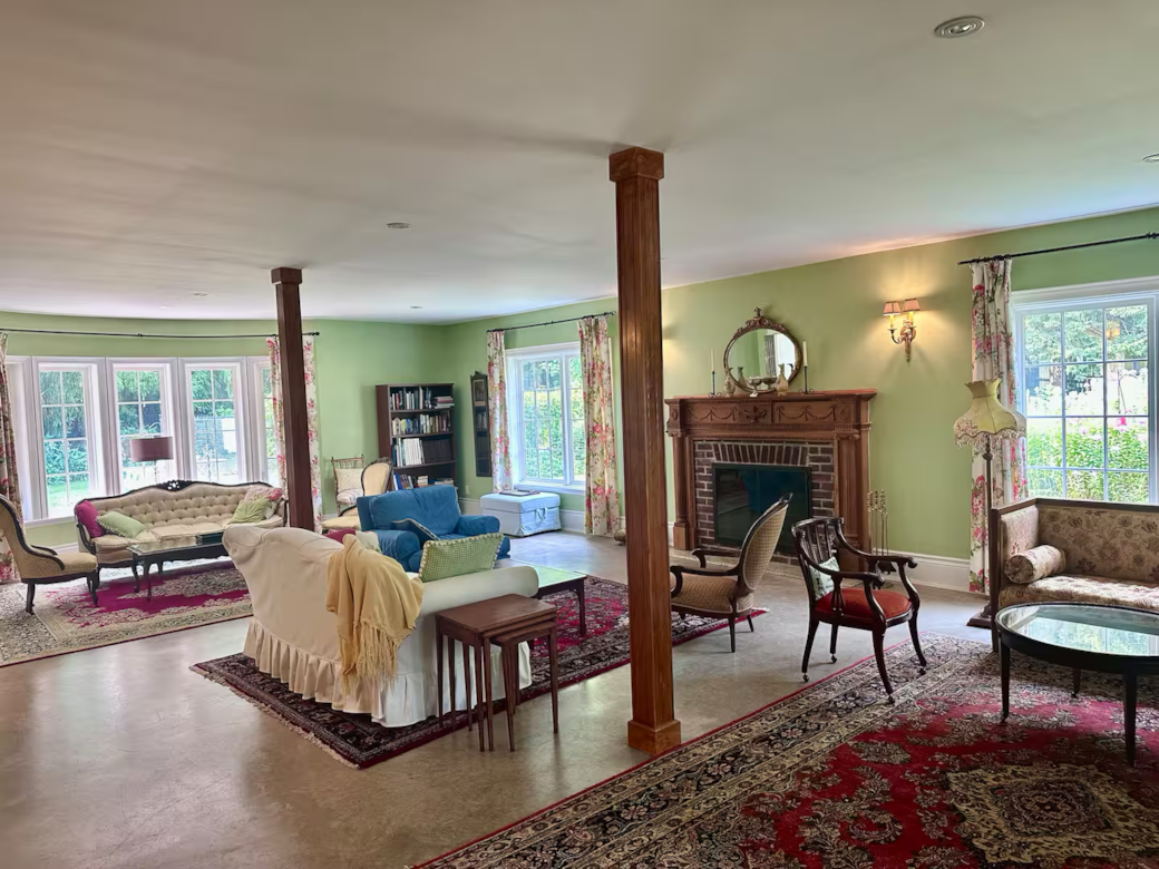 Multi windowed room with multiple book cases & ample room for reading and conversations.  Multi windowed room with multiple book cases & ample room for reading and conversations.