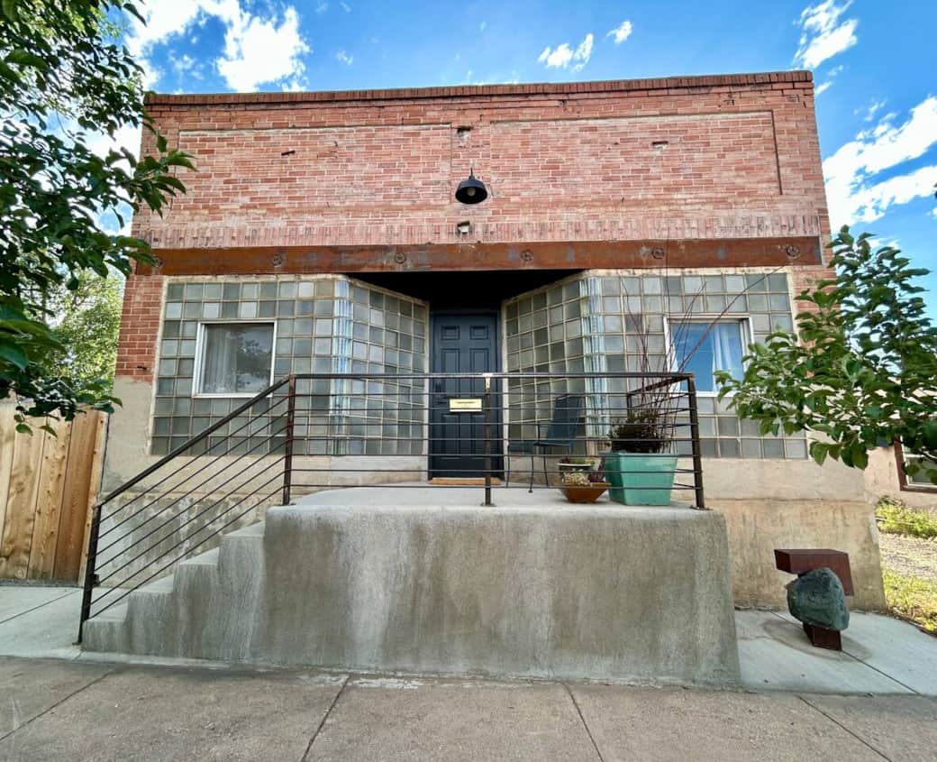 Built in 1920 as a grocery, this restored home blends reclaimed materials and modern finishes. Steps from downtown via an iconic footbridge, it celebrates Laramie’s railtown grit with local art, vintage finds, and laid-back luxury grounded in place.