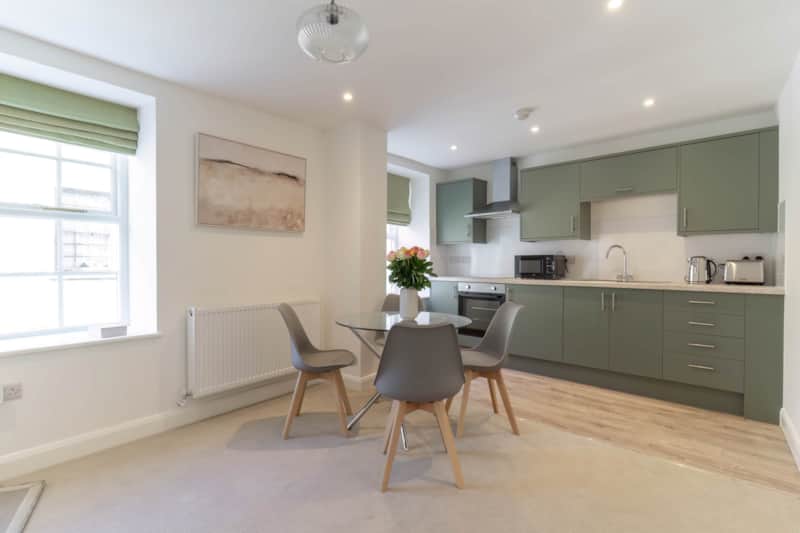 Open-plan kitchen and dining area in a Lonsdale House apartment