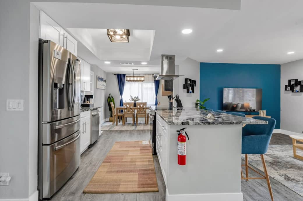 Warm, family-friendly kitchen fully stocked for easy meals and gatherings. Spacious layout and inviting design make it feel like home, with a dedicated coffee bar to start your mornings with ease. Guests love the comfort and convenience.