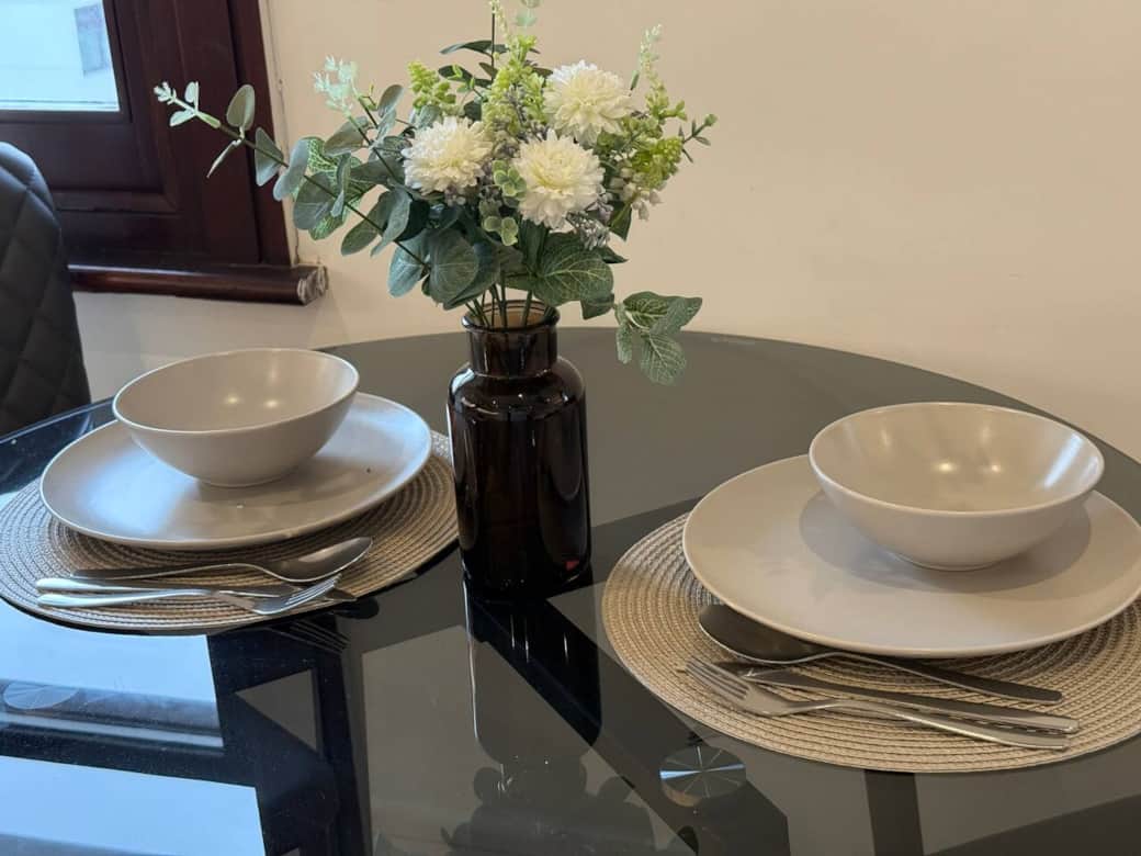 Stylish dining area with table seating for meals, coffee or working from home. Bright space beside the kitchen, ideal for couples, small families and longer stays. Stylish dining area with table seating for meals, coffee or working from home. Bright space beside the kitchen, ideal for couples, small families and longer stays.