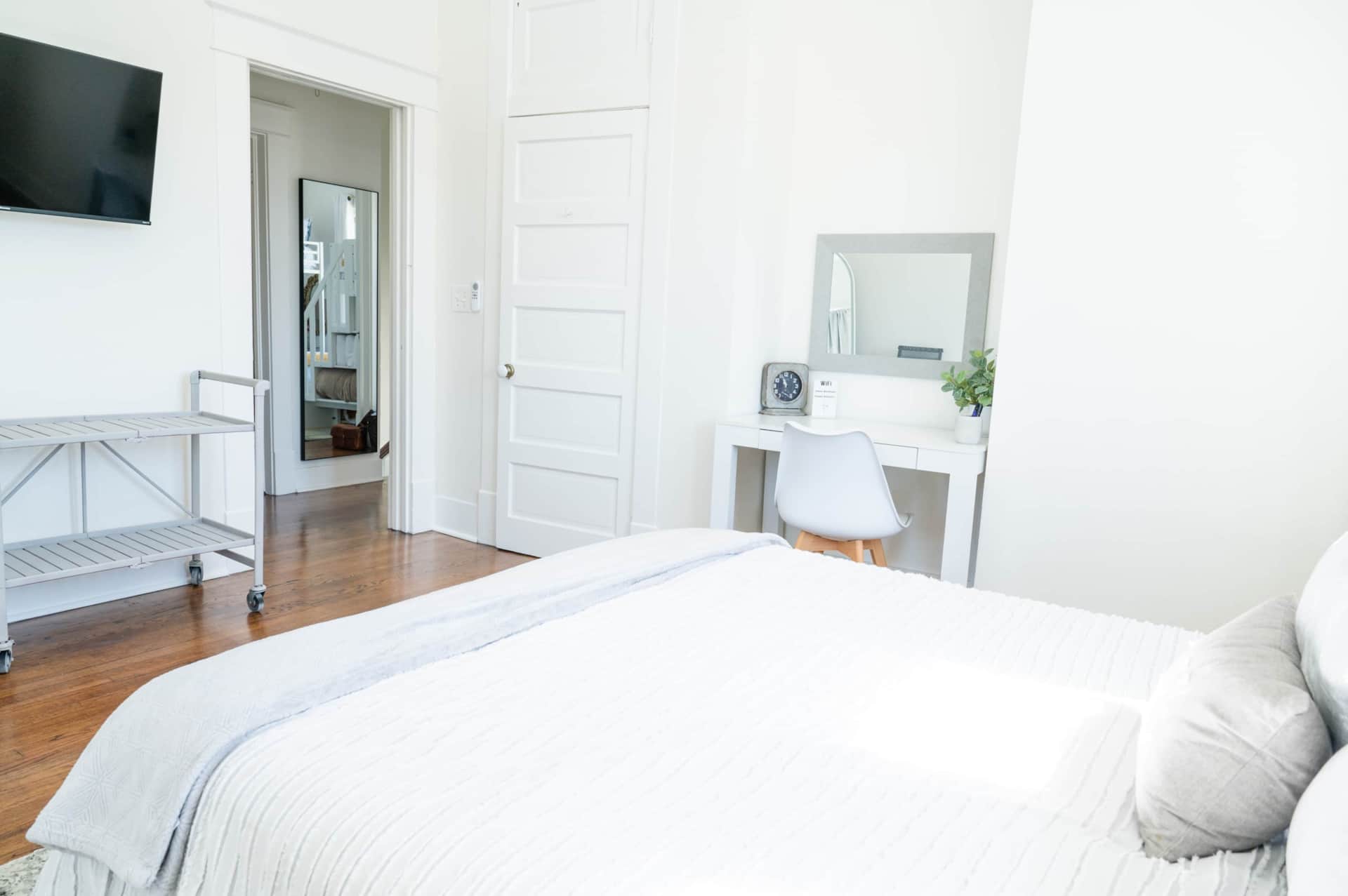 Here is a view from the queen bed.  Notice the TV for private viewing and also the full length mirror in the hall for use by everyone in the house.