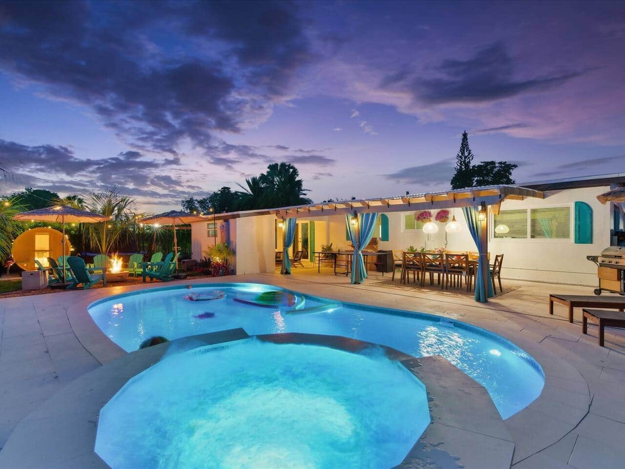 Solara Keys Retreat at twilight — pool, fire pit, and pergola lounge
