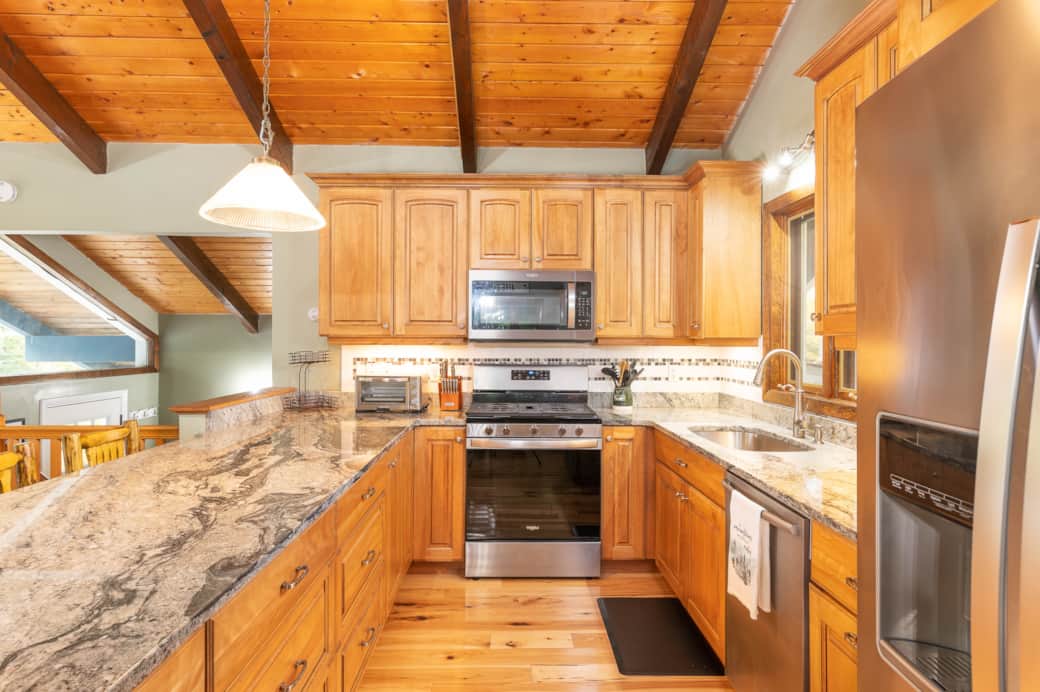 A fully-equipped kitchen with countertop seating for 4. A fully-equipped kitchen with countertop seating for 4.