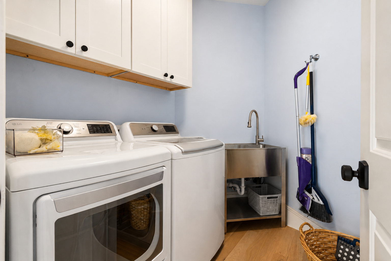 Full-size washer and dryer with a utility sink make it easy to keep up with laundry during your stay