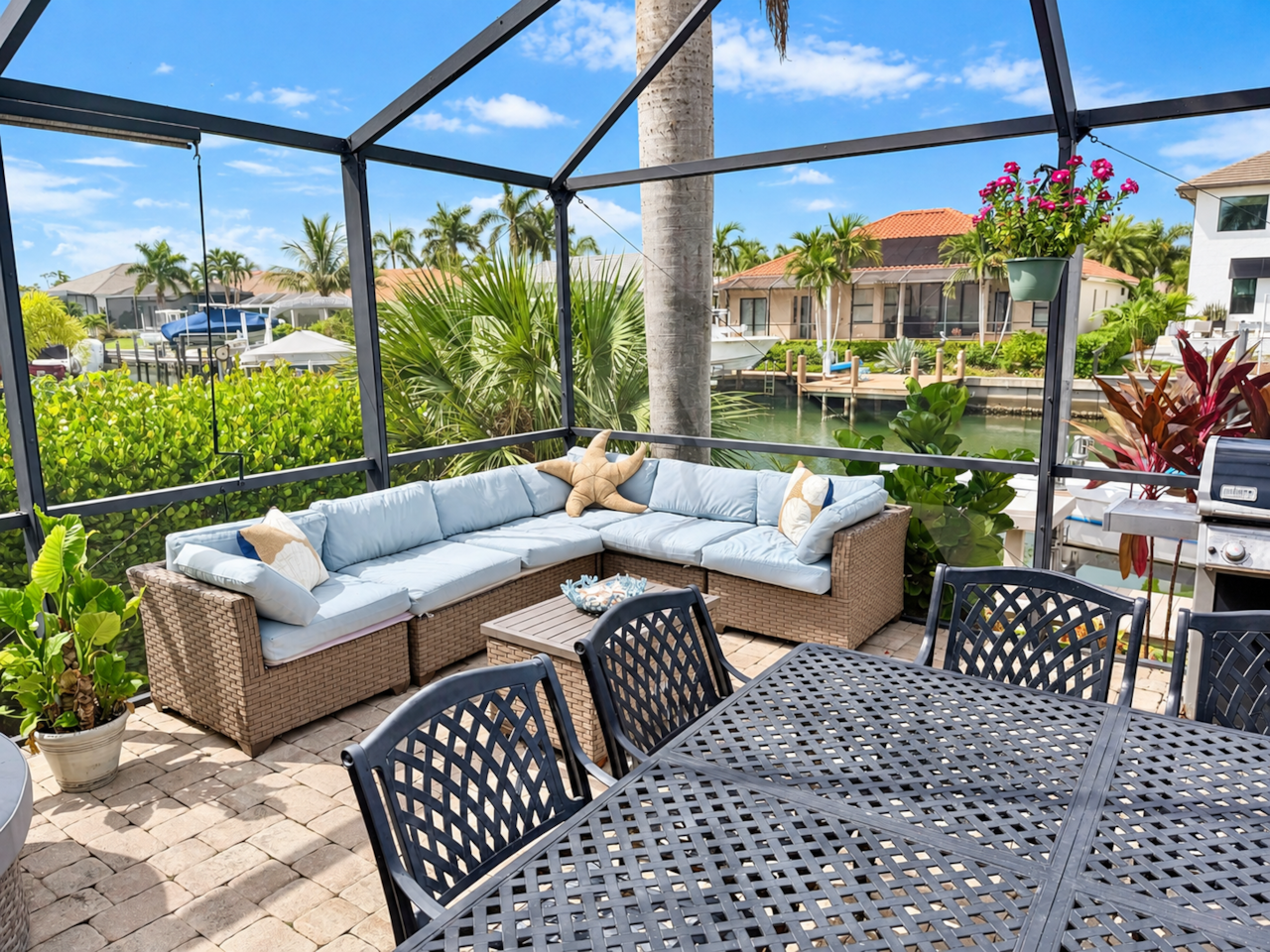 Outdoor lounge seating with canal backdrop