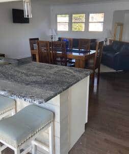 View of upper level living room from kitchen