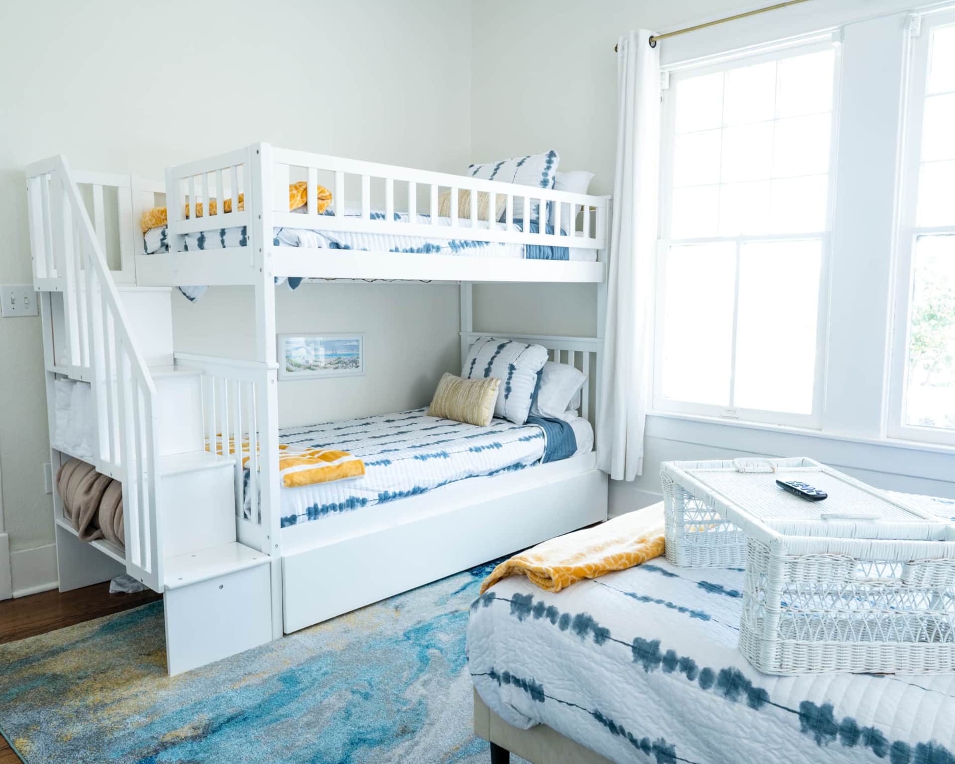 Queen bed with blackout drapes for restful sleep.