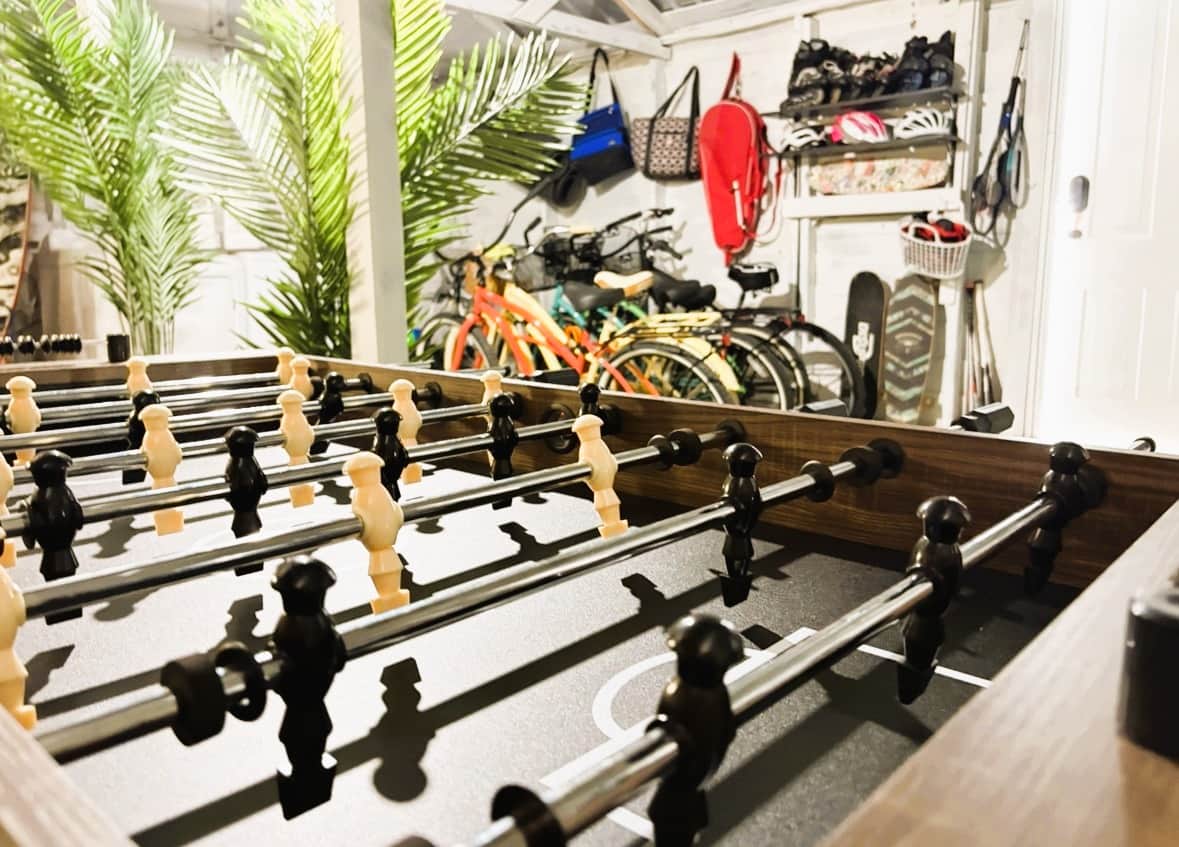 Foosball table inside the garage game lounge at White Magnolia Galveston