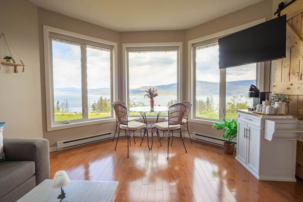 Dining Area with Wraparound Windows and Lake Views Dining Area with Wraparound Windows and Lake Views