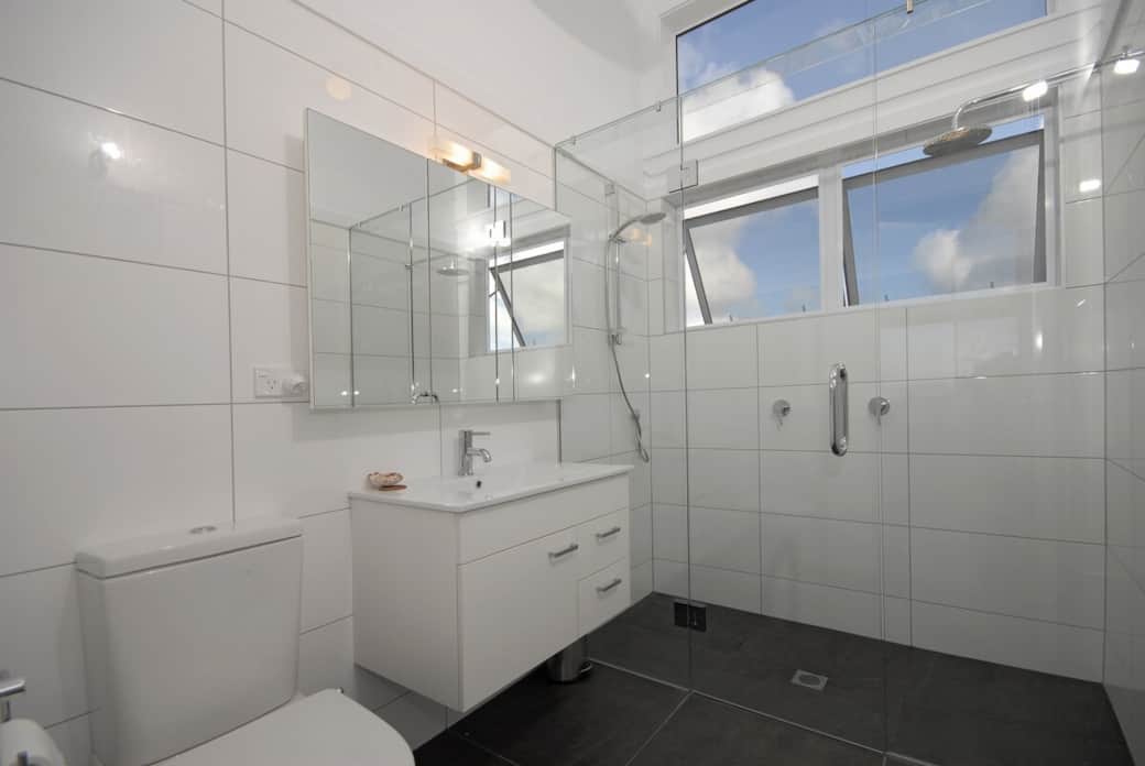 Modern bathroom with a large double shower at Wharau Lodge in Bay of Islands