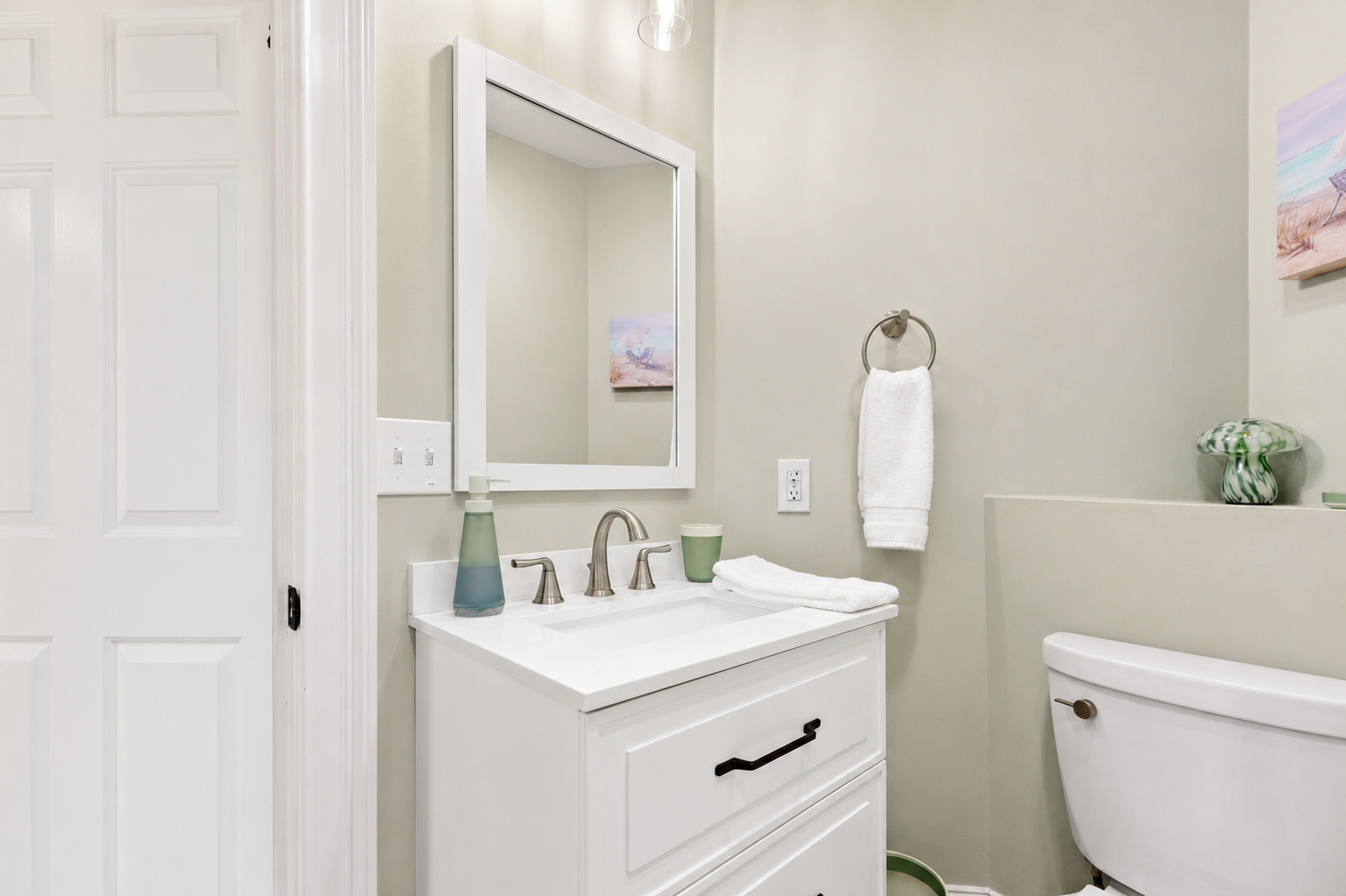 Get ready at the bright vanity with a fresh hand towel and essentials within easy reach.