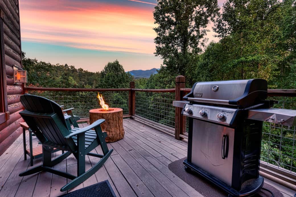 Main floor deck with view of Mt. LaConte, fire pit, gas grill and plenty of comfortable seating.