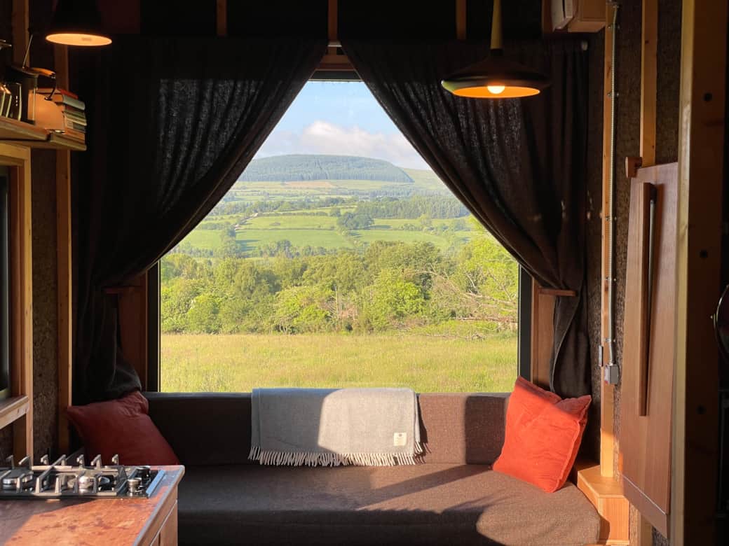 Experience cozy mornings with a view of rolling Wicklow hills from the living room