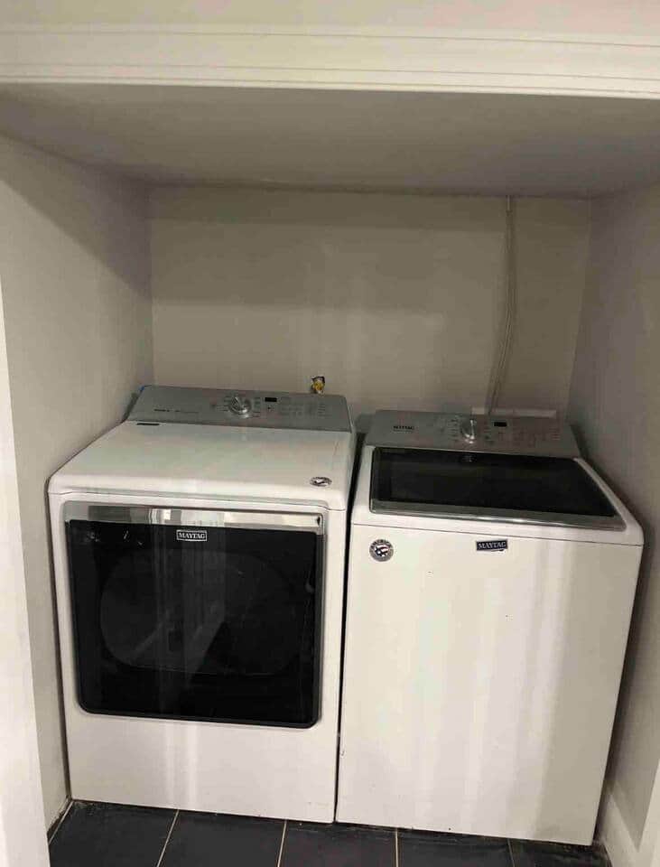 Washer and dryer room inside house.