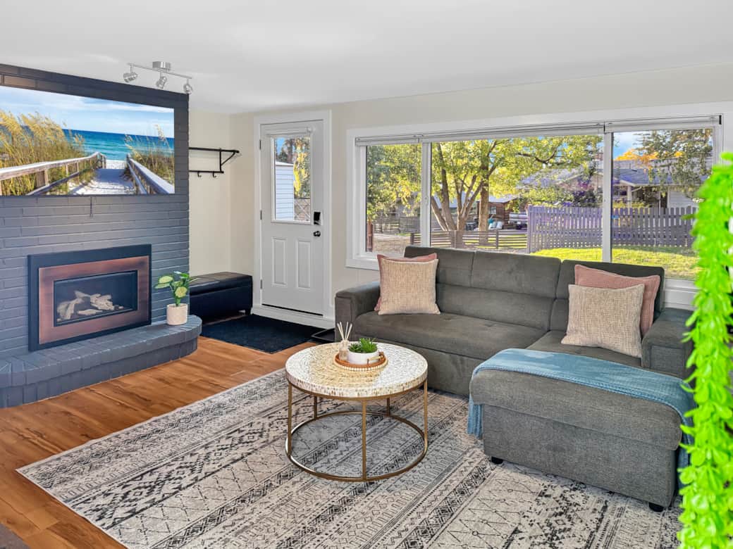 Cozy Living Room with Fireplace and Large Window View