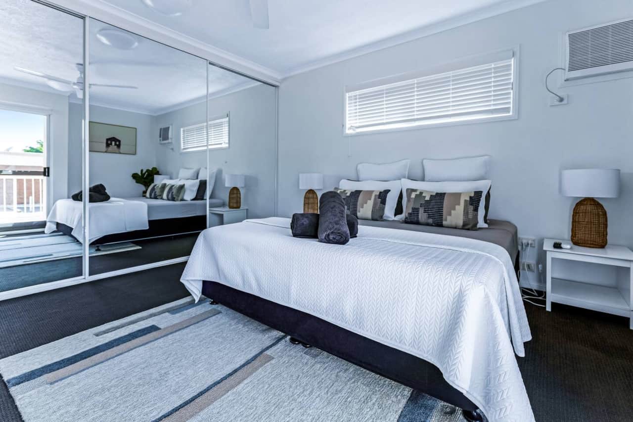 Spacious master bedroom with king sized bed, smart tv, wardrobe ensuite and private balcony. 