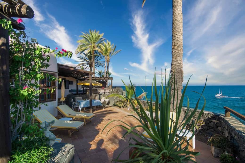 Rocadelmar1 view of garden and middle terrace agava palm tree from garden