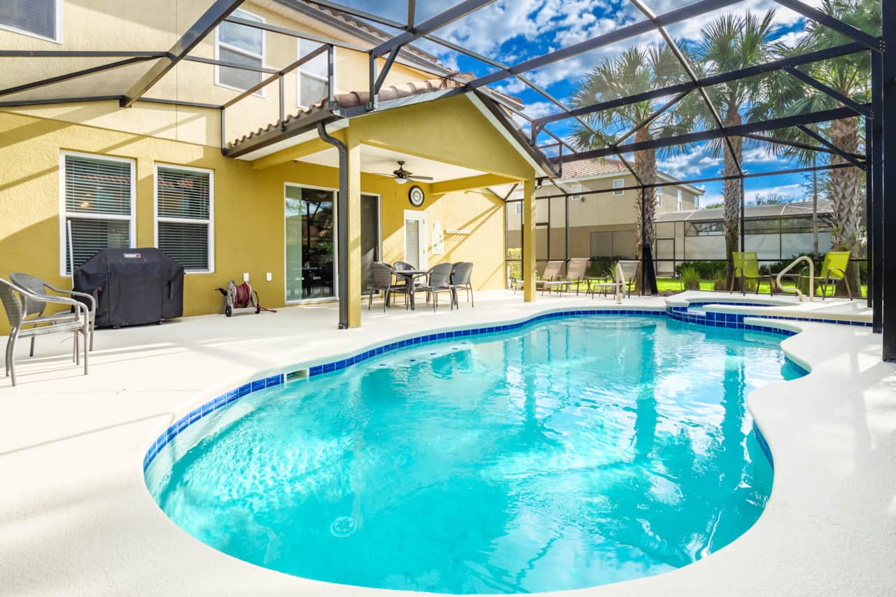 The external area is fully screened and has a safety fence for children around the pool