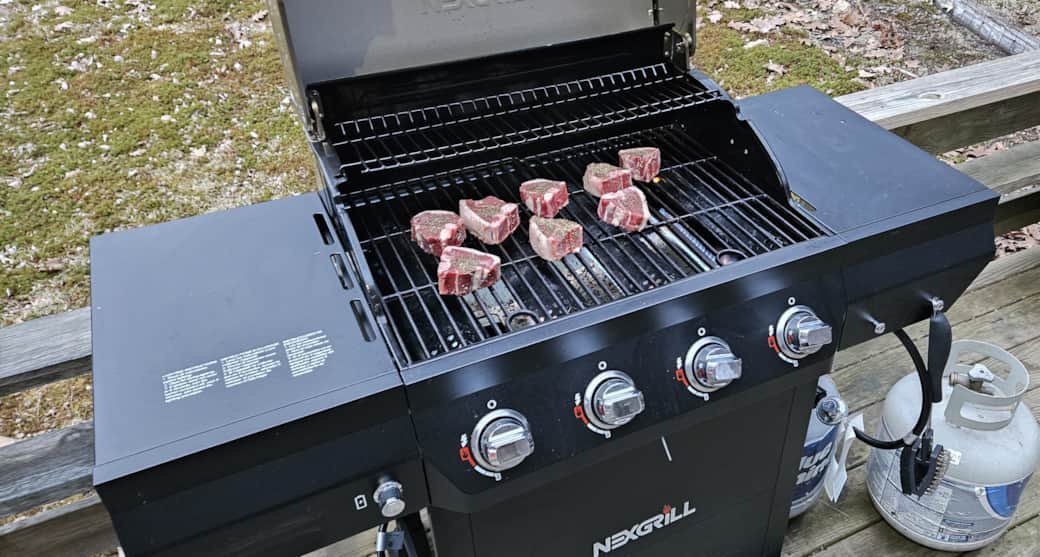 Outdoor propane BBQ grill on the patio, perfect for summer cookouts