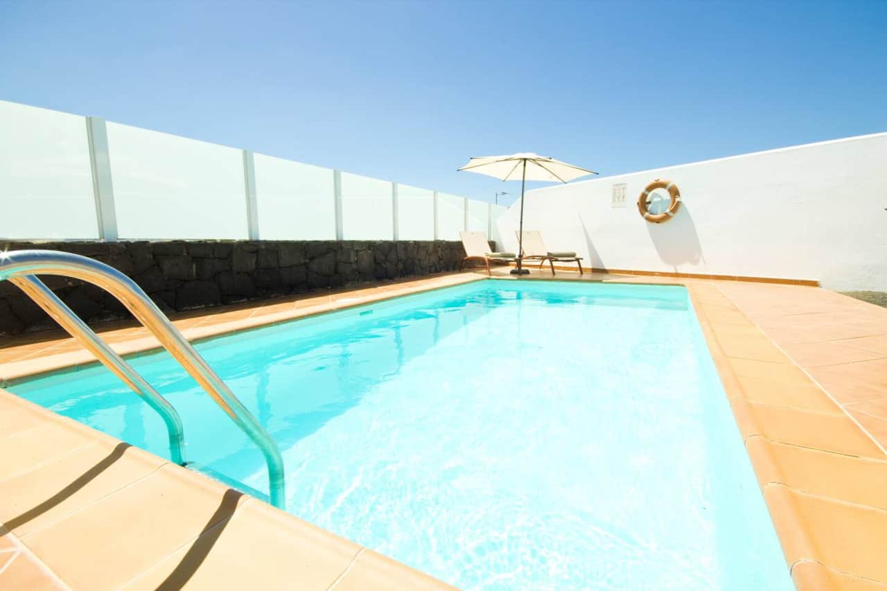 Sunny terrace with loungers and private pool at Villa Costa Papagayo 18