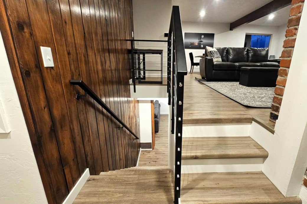 Steps down to basement bedroom (full bed) and rec room with a 2nd TV, queen sleeper sofa, and expandable game table. Storage closet with games, pack-n-play, high chair, beach towels, cooler and extra bedding is also downstairs. 