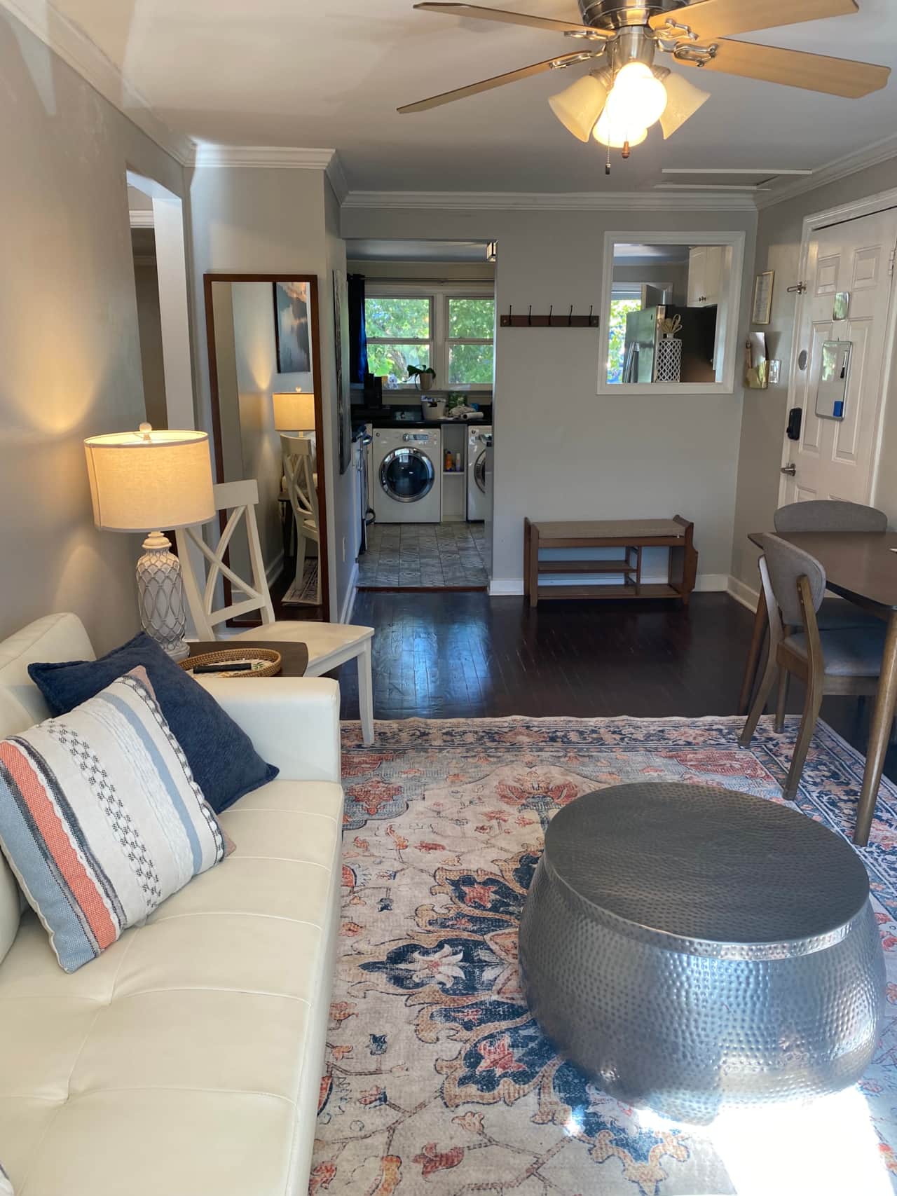 Bright, stylish living area with comfy seating, dining nook, and in-unit laundry.