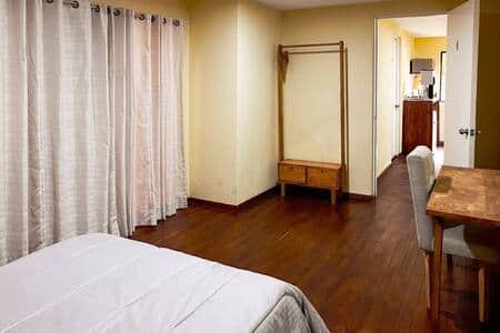 Bed is behind the curtain