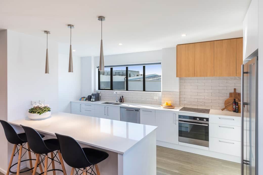 Kitchen with coffee machine and complimentary assortment of tea.