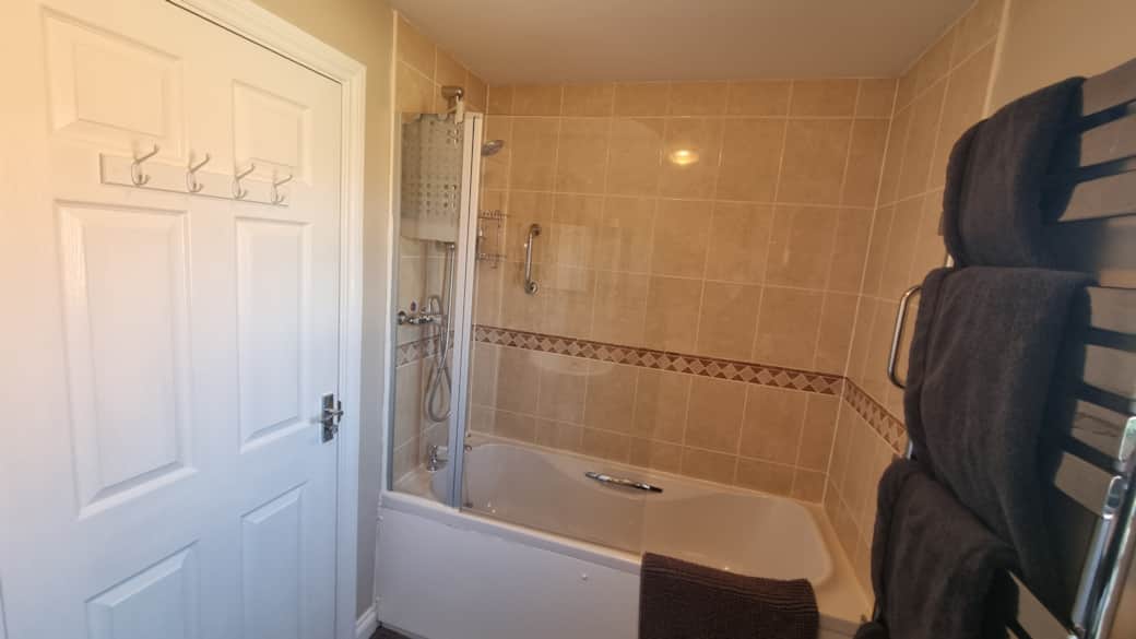 Guests Private Bathroom with over-bath shower