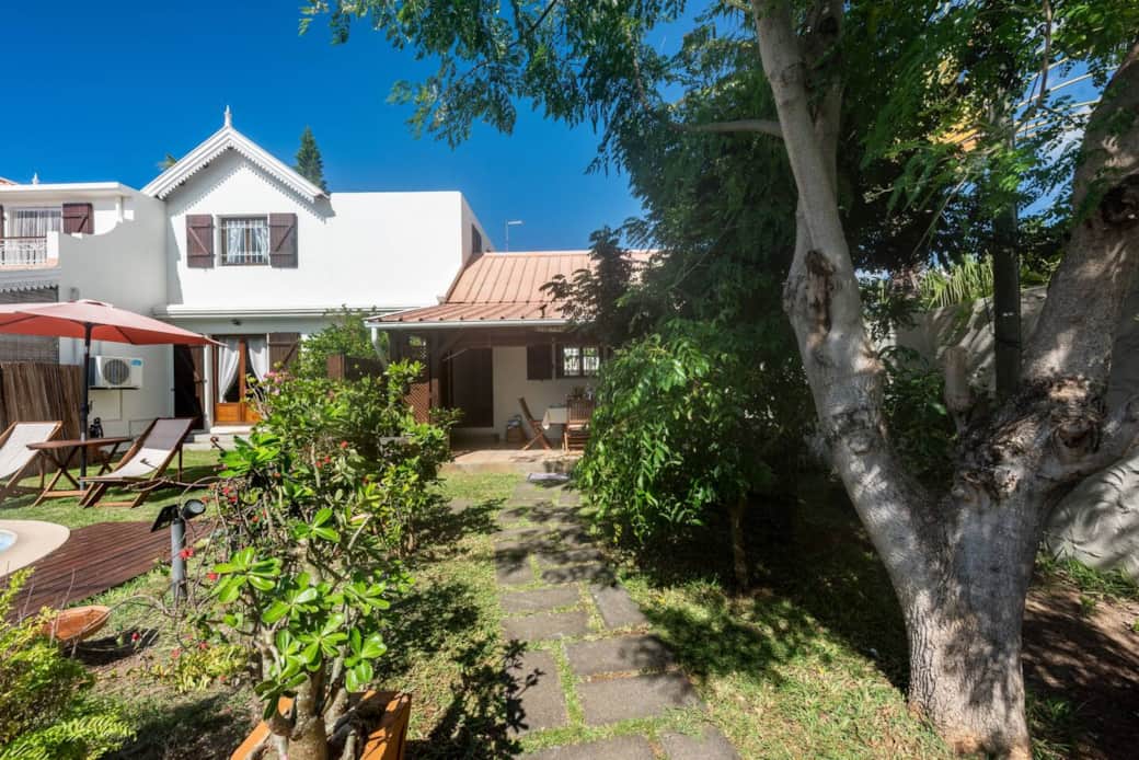 View of the garden and property from the small entrance.  The cottage is on the right hand side 