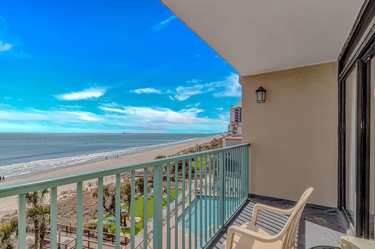 Direct oceanfront balcony • Beach + pool views • Private outdoor seating.