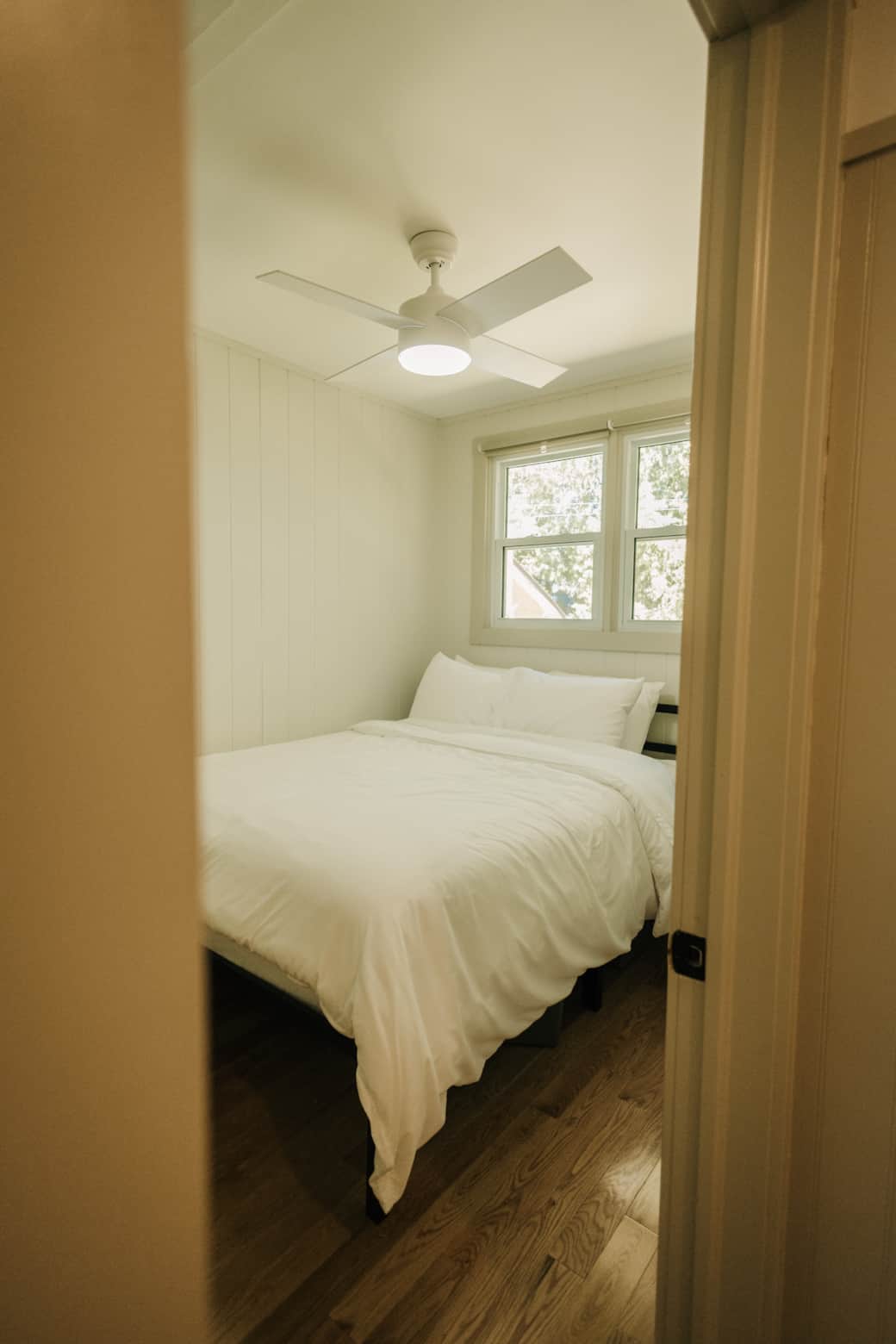 First bedroom complete with queen bed and blackout curtains