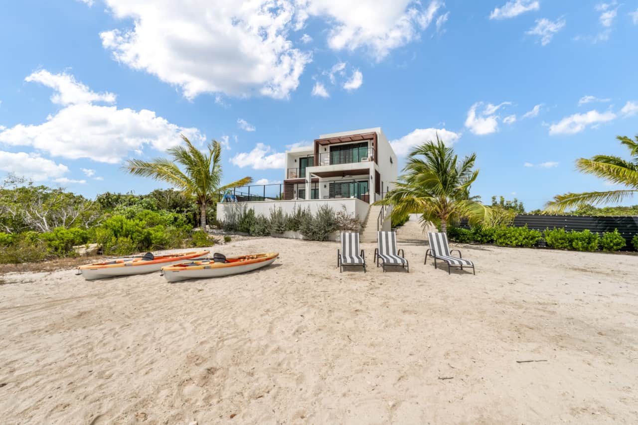 Private beach with loungers and kayaks