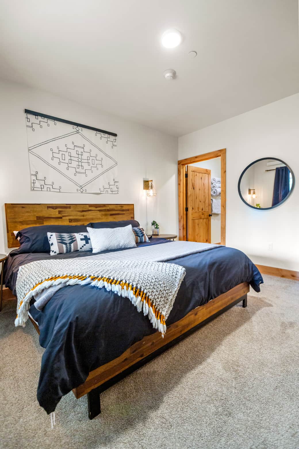 BEDROOM #1: Primary // Private Bathroom //King Memory Foam Mattress // Bottom Floor // 55" 4K TV