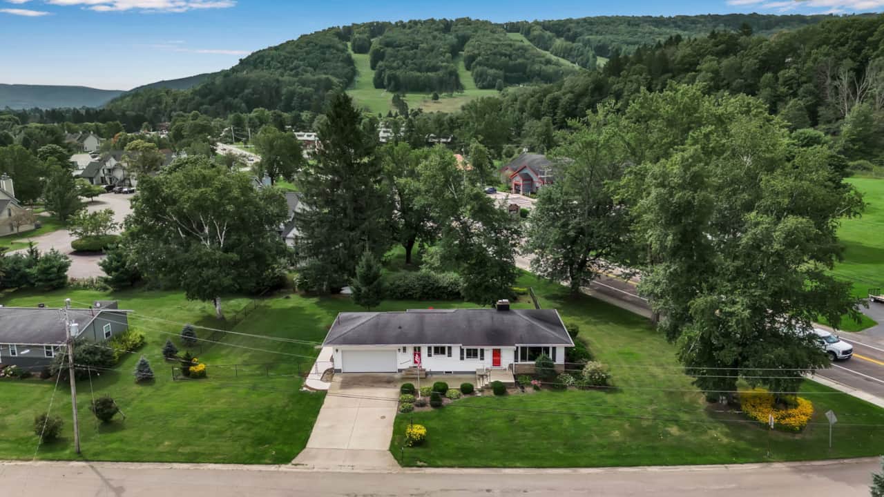 Walk to Holiday Valley and the village with slope views from the spacious backyard.