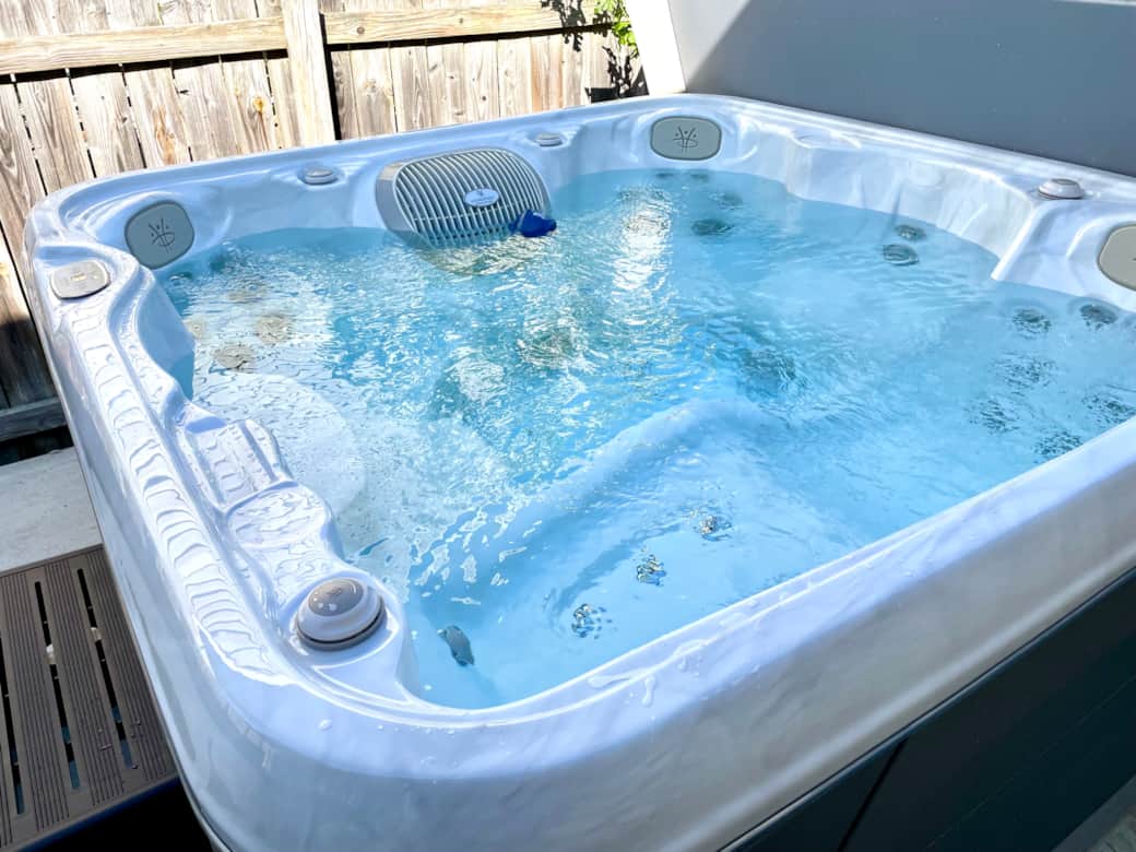 Relax in a 5-person hot tub with soothing waterfall jets and LED lights for a perfect evening