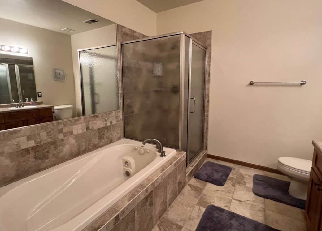 Primary bath features a whirlpool tub and shower, plus large vanity area