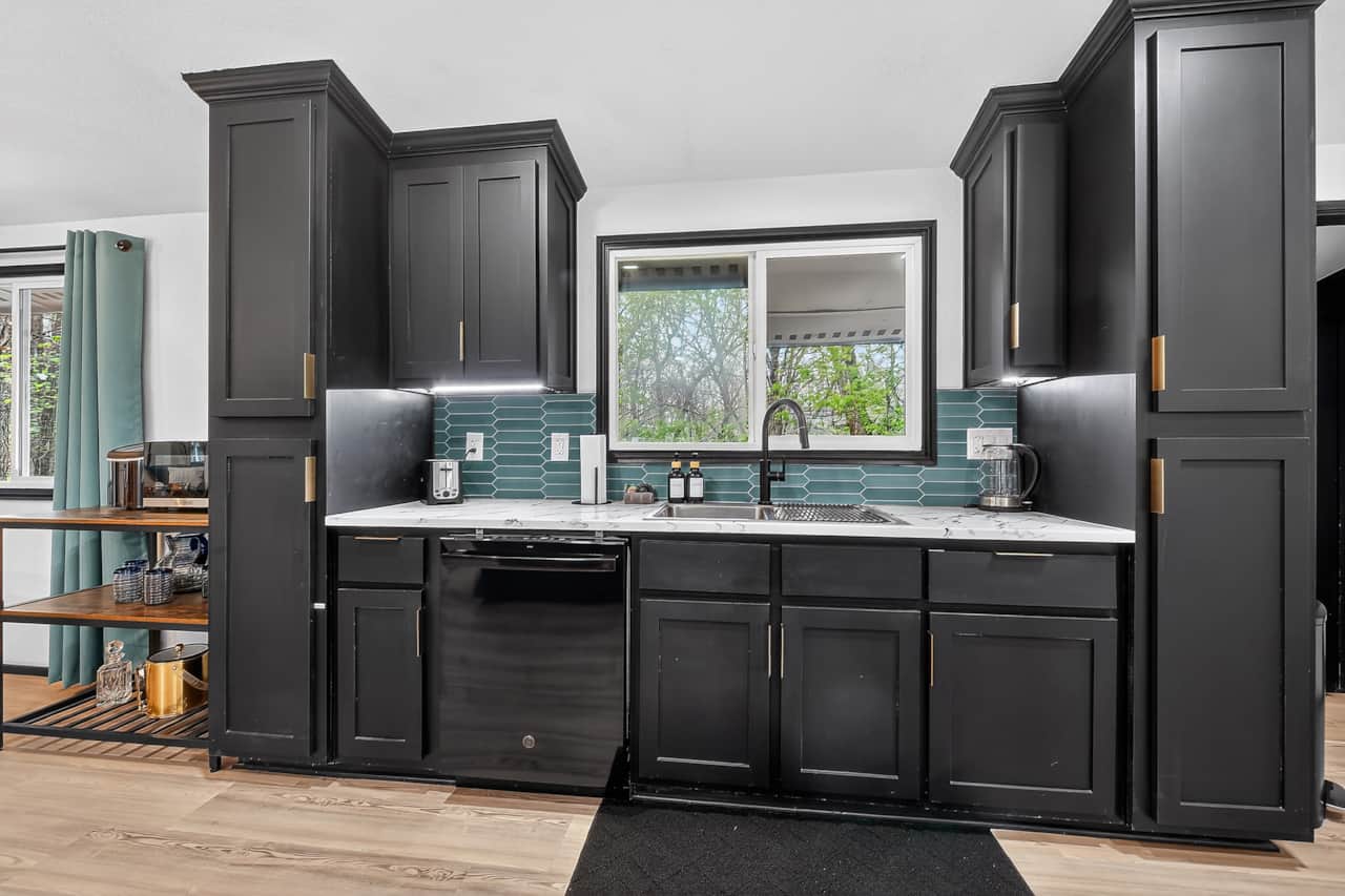 Bright kitchen with modern appliances, generous counter space, and a convenient coffee bar.
