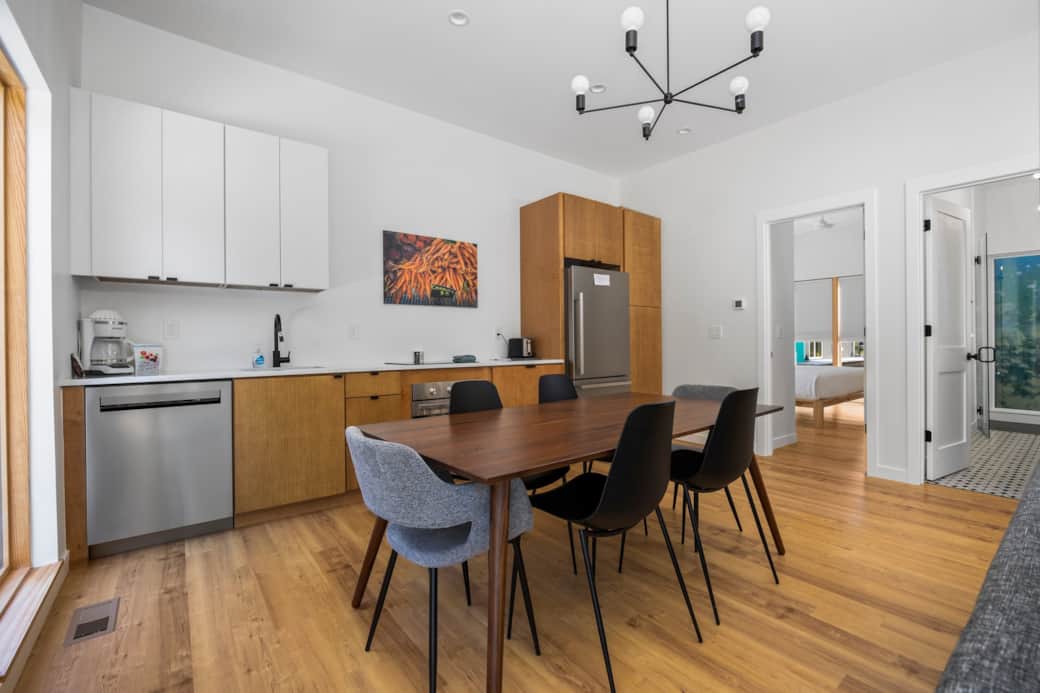 Dining room and kitchen with door to bedroom and bathroom