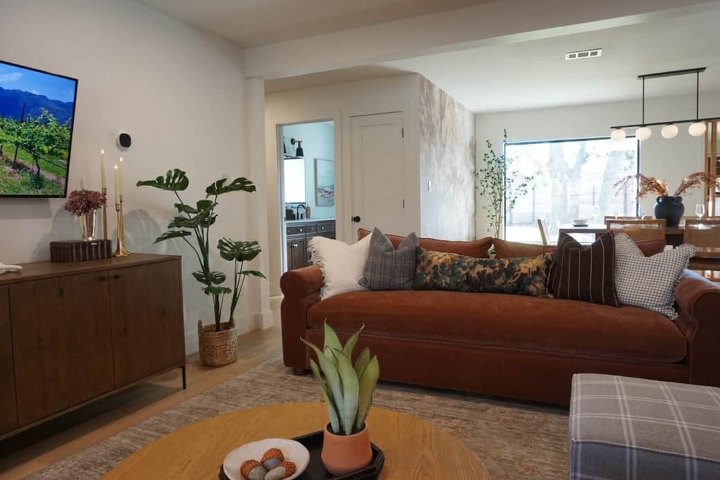 comfy living room with ample seating and a smart TV