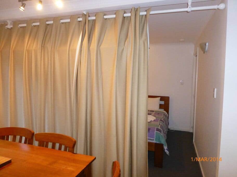 Bedroom 3 features blackout curtains.